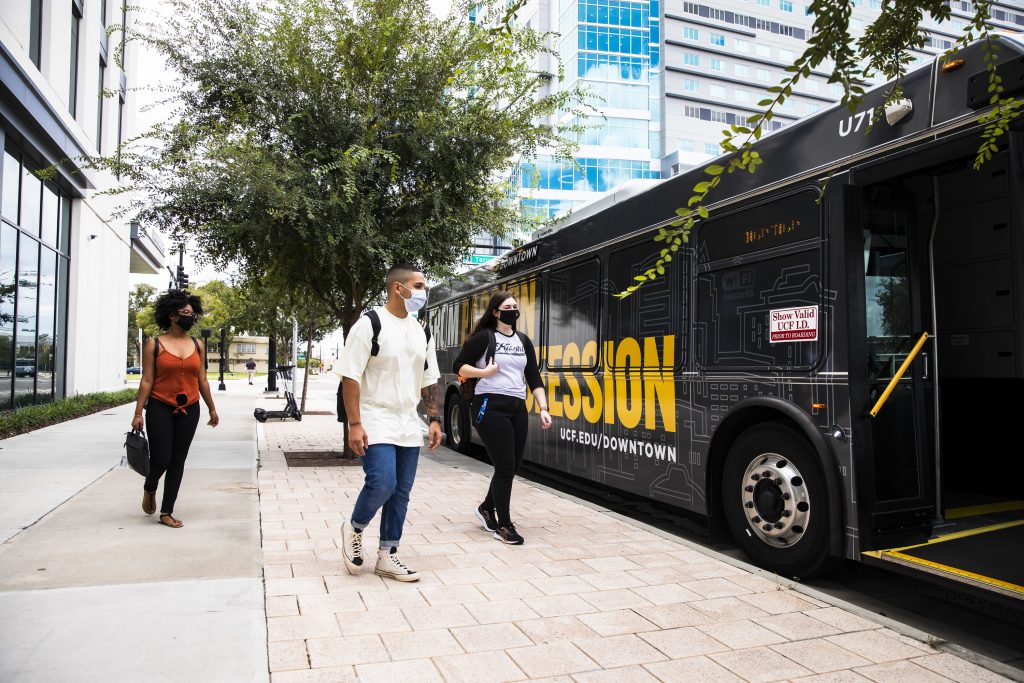 UCF students boarding a bus