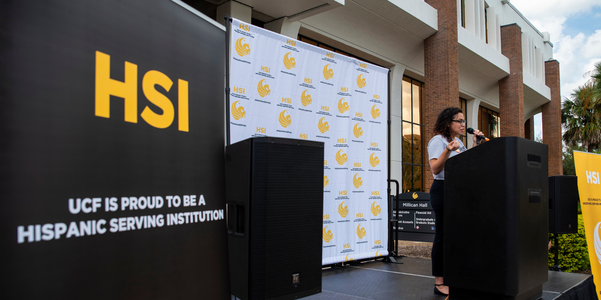 image of the HSI banner and person speaking at a podium