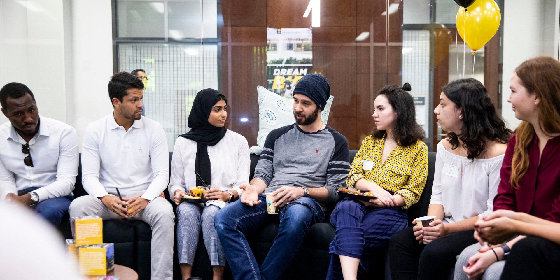 International students converse in the UCF Global building.