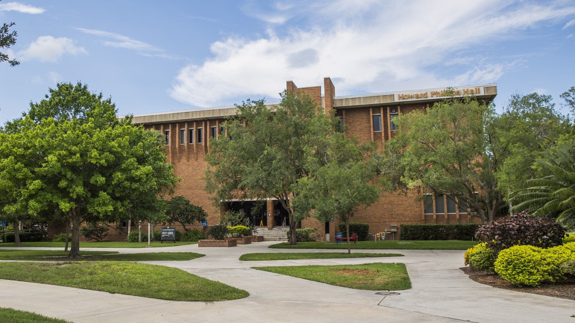 Exterior building shot of the Howard Phillips Hall west entrance.