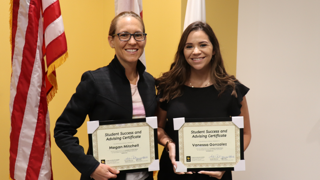 Megan Mitchell and Vanessa Gonzalez pose with their SSA Certificates